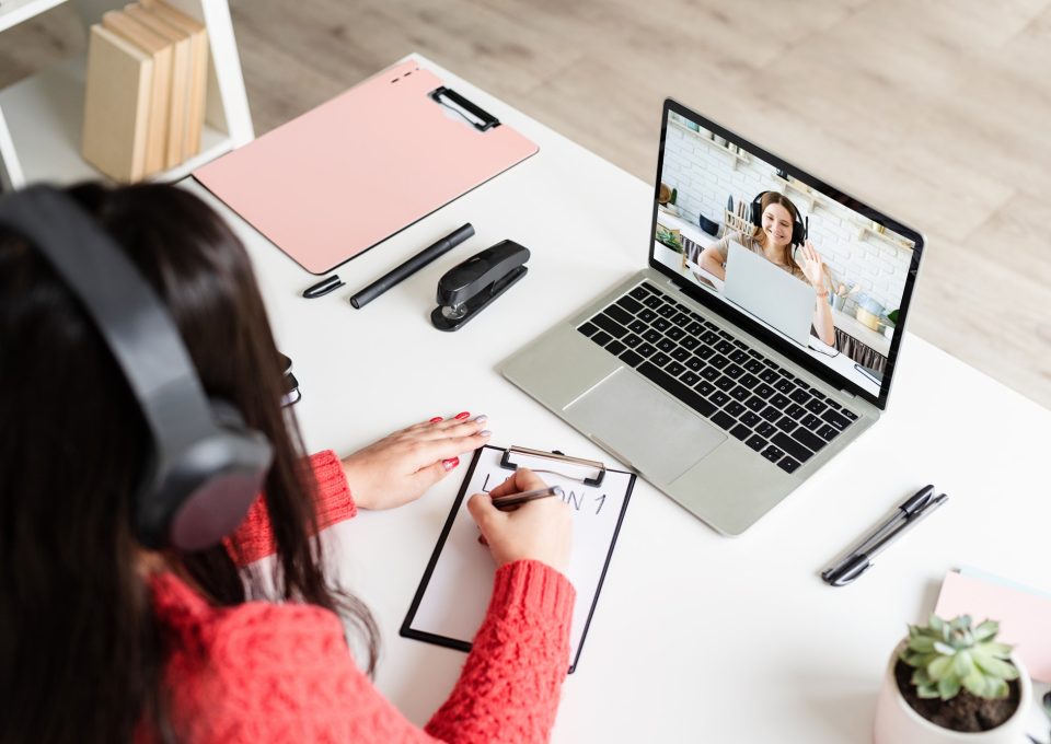 young-latin-woman-in-black-headphones-teaching-english-online.jpg